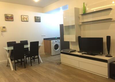 Modern living and dining area with kitchenette