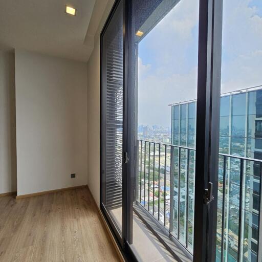 View of balcony with large glass doors