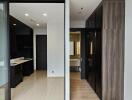 Modern apartment interior with kitchen and bathroom entrance