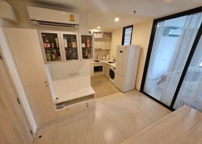 Modern kitchen with white cabinetry and integrated appliances