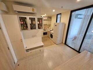 Modern kitchen with white cabinetry and integrated appliances