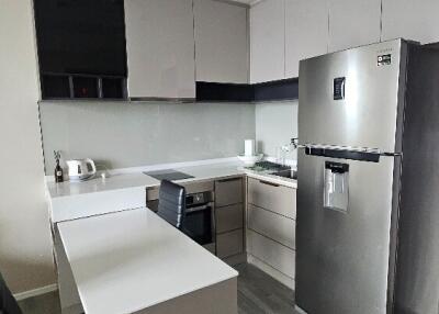 Modern kitchen with appliances and dining area