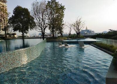 Luxury outdoor pool area with lounge chairs