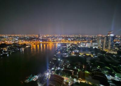 Night view of a city with river and illuminated buildings