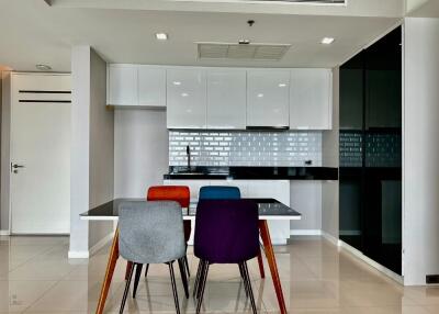 Modern kitchen with colorful dining chairs