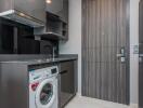 Compact modern kitchen with integrated washing machine