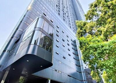 Modern high-rise building exterior with glass and metal facade