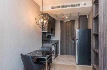 Modern kitchen with dining area and black counter