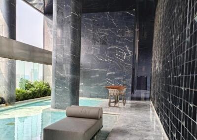 Luxury building with indoor pool and lounge area