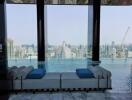 Elegant seating area with an infinity pool and panoramic city view