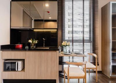 Modern kitchen with wooden cabinets and breakfast nook