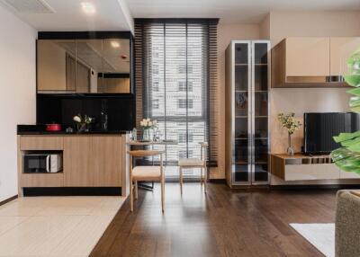 Modern living area with adjoining kitchen and dining space