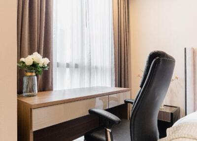 Bedroom with office desk and chair near window