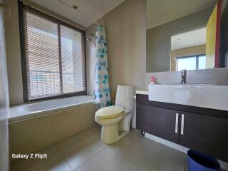 Modern bathroom with bathtub and large window