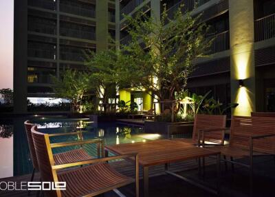 Outdoor Pool and Seating Area at Building Complex