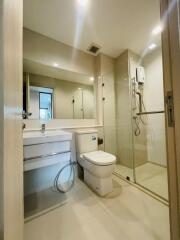 Modern bathroom with glass shower enclosure and large mirror