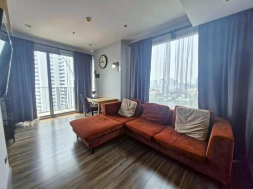 Spacious living room with a large window view