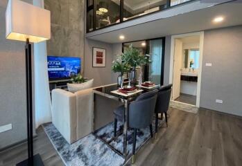 Modern living room and dining area with loft