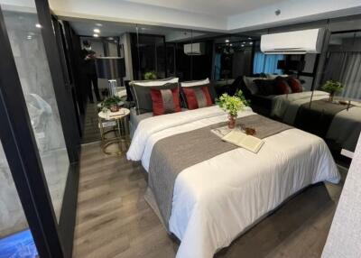 Modern bedroom with ample lighting and contemporary decor