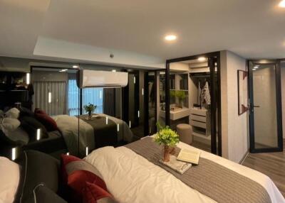 Modern bedroom with cozy bedding and mirrored closet