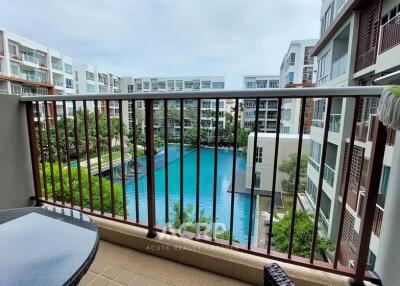 Balcony with a view of the swimming pool and surrounding buildings