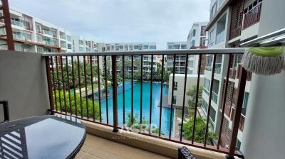 Balcony with a view of the swimming pool and surrounding buildings