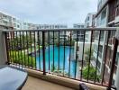 Balcony with a view of the swimming pool and apartments