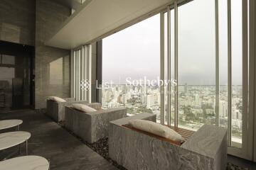 modern high-rise building lounge with large windows and city view