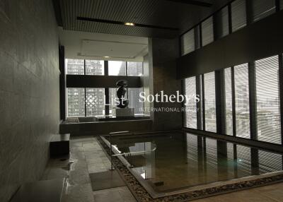 Indoor pool area with city view