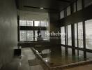 Indoor pool area with city view