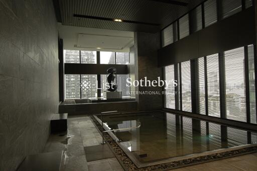 Indoor pool area with city view