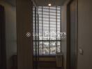 Room with blinds overlooking cityscape