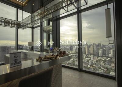 Modern living room with large windows and city view