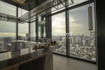 Modern living room with large windows and city view