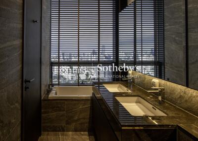 Luxurious bathroom with double sink and city view