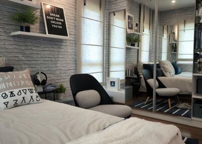 Modern bedroom with cozy decor, mirrors and soft lighting