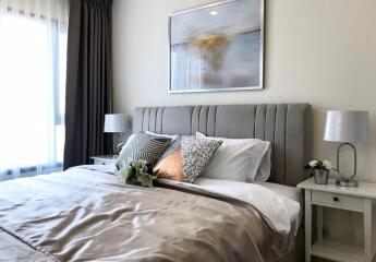 Stylish and modern bedroom with well-decorated bedding and side tables