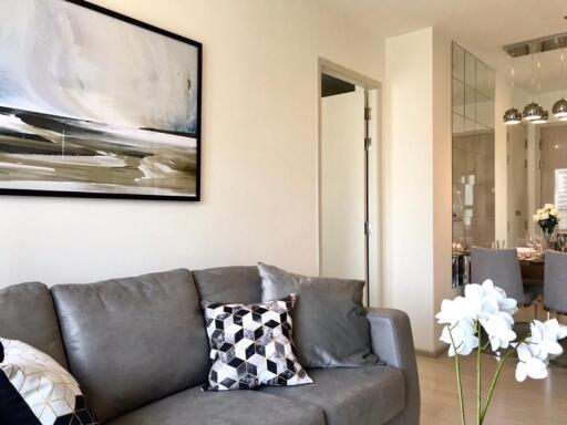 Modern living room with gray sofa and decor