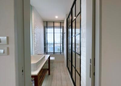 Modern bathroom with large window and glass partition