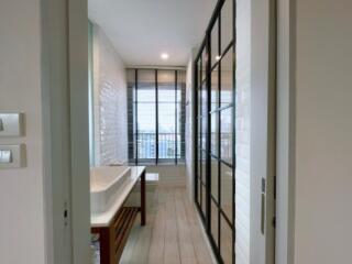 Modern bathroom with large window and glass partition