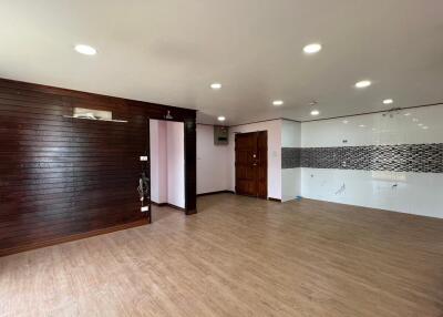 Spacious living room with wooden flooring and contemporary finishing