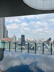 Rooftop view with skyline and pool