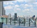 Rooftop view with skyline and pool