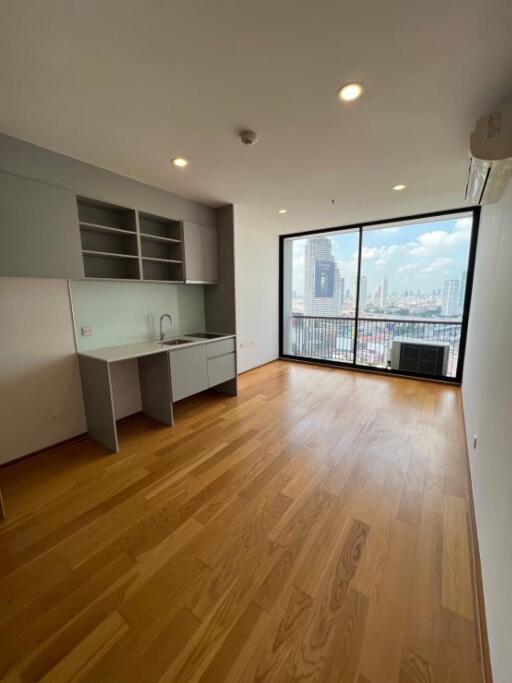 Modern living room with large window and city view