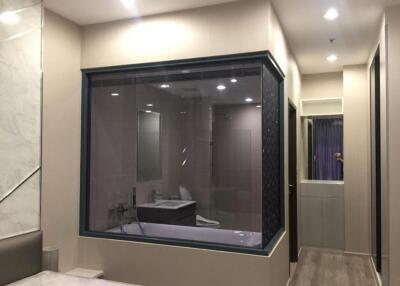 Modern bathroom with large glass window and bathtub