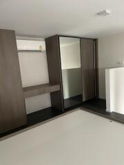 bedroom with built-in wardrobe and air conditioning