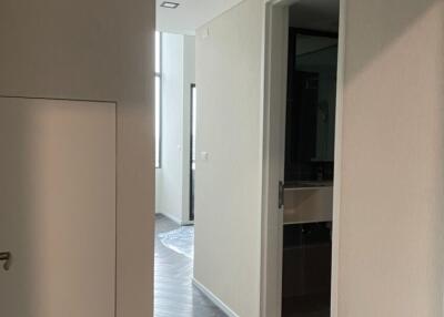 Modern hallway with sleek flooring and light walls