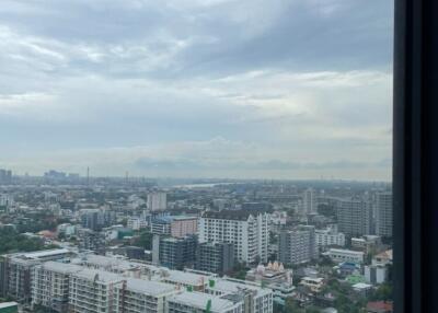 High-rise cityscape view from window