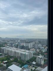 High-rise cityscape view from window