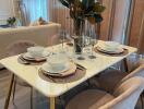 Elegant dining area with marble table and cushioned chairs